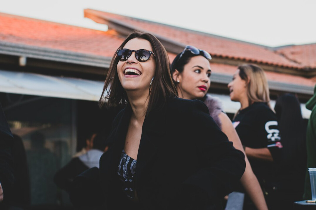 Brazilian woman laughing during a warm conversation